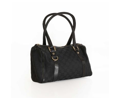 A Gucci black canvas Abbey Boston bag,with dual rolled leather handles and detailing, silver tone hardware, zip closure openi