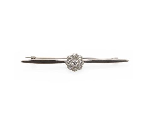 A white gold diamond cluster bar brooch,an old European diamond millegrain collet set to a surround of smaller old cut diamon