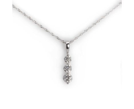 A three stone diamond pendant with chain, designed as a vertical line of graduated round brilliant cut diamonds, spot set abo