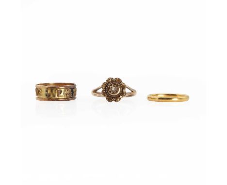 A 22ct gold wedding band,with London hallmarks for 22ct gold, possibly 1949, a band ring with astrological symbols embossed a