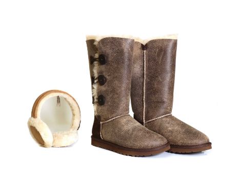 A pair of Ugg W Bailey button triplet bomber boots,size 4.5,and a pair of Ugg earmuffs,boxedCondition ReportBoots - appear to