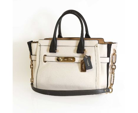 A Coach cream pebbled leather swagger satchel, dual rolled black leather handles, detachable shoulder strap, gold tone hardwa