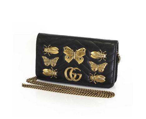 A Gucci black leather Marmont bug wallet, on chain,with gold tone bugs and chain, magnetic closure, interior with key chain a