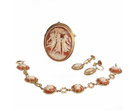 A gold shell cameo jewellery suite,comprising a gold shell cameo brooch, 38mm x 30mm, depicting three ladies dancing, to a to