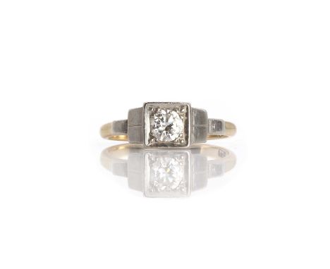 A single stone diamond ring, a round brilliant box set to a square shape open gallery with chenier details, to stepped should