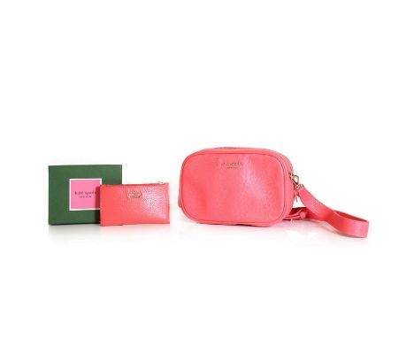 A Kate Spade coral leather medium camera bag,with detachable flat handle, zip closure, with original purchase tag and dust ba