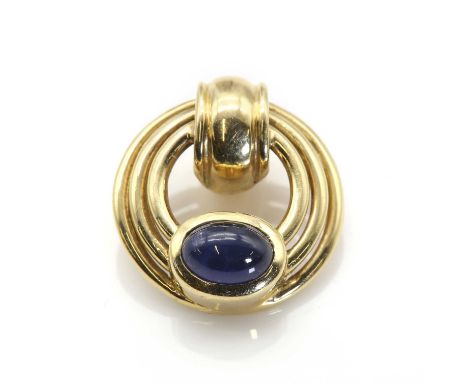 A single stone sapphire hoop pendant, with an oval cabochon sapphire, rub set at the base of a three row hoop pendant with a 