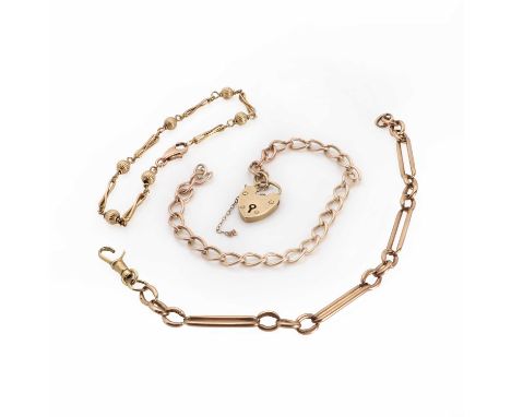 Three 9ct gold chain bracelets, the first of curb links with a heart locket clasp, London 1969, the second of fancy alternati