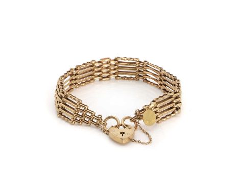 A 9ct gold gatelink bracelet with 18ct charm, composed of five bar gates and four bar joiners, the outer bars of crinkle-cran