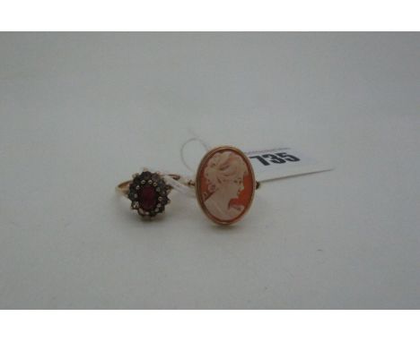 An Oval Shell Carved Cameo Ring, depicting female profile, stamped "750" (finger size S); together with a 9ct gold garnet set