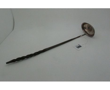 A Georgian Toddy Ladle, the plain oval bowl with inset George III Shilling, 1787(?), with twisted baleen handle, approximatel