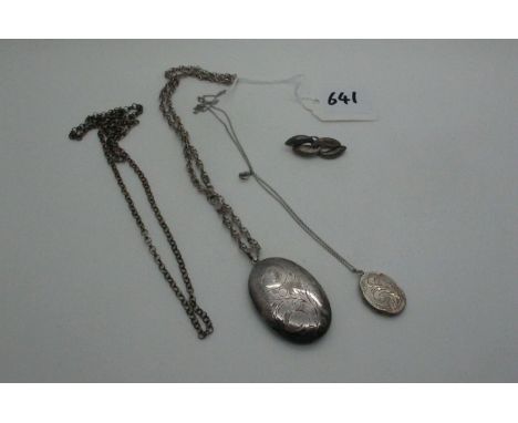 A Large Oval Locket Pendant, allover leaf scroll engraved, on a fancy link chain, together with a smaller oval locket pendant
