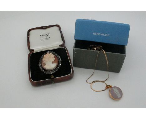 An Oval Shell Carved Cameo Brooch, depicting female profile, within marcasite set border, in a vintage case; together with a 