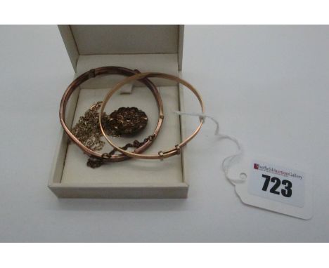 An Edwardian Hinged Bangle, of belt / buckle design hinged to snap clasp (dents); together with an expanding bangle, a decora
