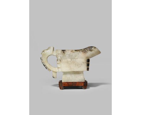 A CHINESE PALE CELADON JADE POURING VESSEL, GONG LATE MING DYNASTY Carved in shallow relief with taotie masks and mythical be