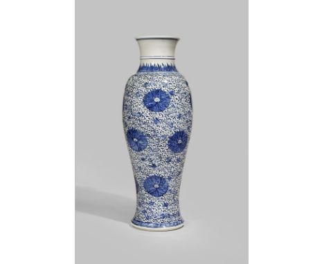 A CHINESE BLUE AND WHITE TALL SLENDER BALUSTER VASE KANGXI 1662-1722 Painted with twelve large aster flowerheads amongst scro