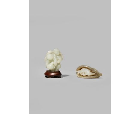 TWO CHINESE CELADON JADE CARVINGS QING DYNASTY One of the Hehe Erxian holding a spray of lotus and a circular box, together w