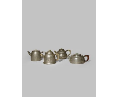 ONE CHINESE PEWTER AND THREE PEWTER-ENCASED YIXING TEAPOTS AND COVERS QING DYNASTY Three with C-shaped jade handles, two with