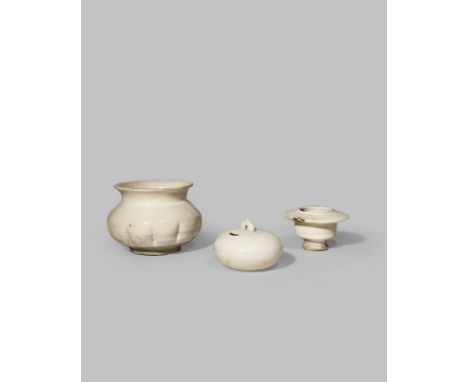 THREE CHINESE WHITE GLAZED VESSELS SONG DYNASTY AND LATER Comprising: a Ding moulded bowl with a lobed body and a flared rim,