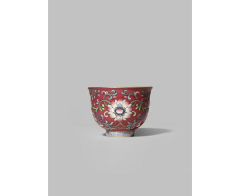 A CHINESE FAMILLE ROSE 'LOTUS' WINE CUP FOUR CHARACTER QIANLONG MARK BUT LATER Decorated to the exterior with stylised lotus 