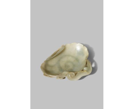 A CHINESE PALE CELADON JADE 'LOTUS' BRUSH WASHER 19TH CENTURY Carved in form of a half-rolled lotus leaf supported on a scrol