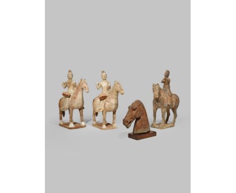 THREE CHINESE POTTERY MODELS OF HORSES AND RIDERS TANG DYNASTY OR LATER The riders wearing white robes turned to the right si