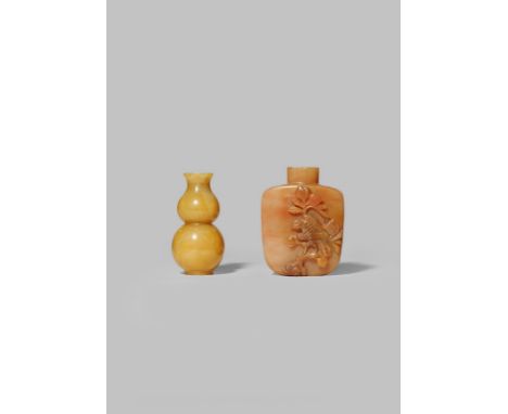 TWO CHINESE HARDSTONE SNUFF BOTTLES 19TH CENTURY One carnelian-agate, carved in high relief with a hawk perched on a fruiting