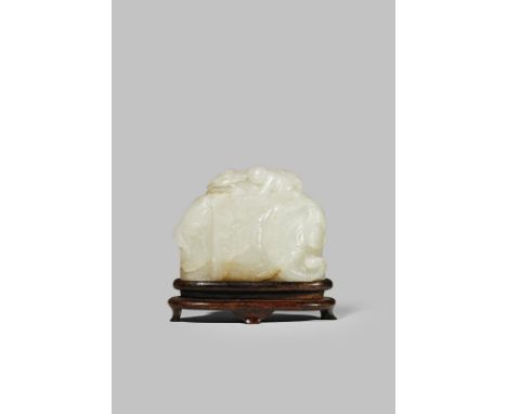 A CHINESE PALE CELADON JADE BELT BUCKLE 18TH CENTURY Carved as a lavishly caparisoned elephant turning his head to the side, 