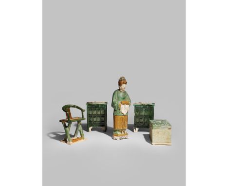 A CHINESE POTTERY FIGURE AND FOUR POTTERY ITEMS OF FURNITURE MING DYNASTY The figure holding a scroll box, together with mode