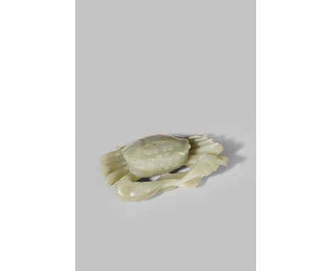 A CHINESE CELADON JADE MODEL OF A CRAB 18TH/19TH CENTURY Seated neatly on top of a millet ear with legs tucked under the body