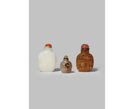 THREE CHINESE HARDSTONE SNUFF BOTTLES QING DYNASTY One of white jade carved in shallow relief with a figure in a boat by a ro