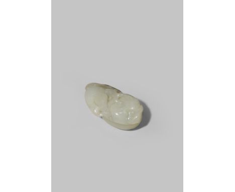 A CHINESE WHITE JADE CARVING OF TWO SHARON FRUIT QING DYNASTY The two fruit issuing from one leafy branch with a small bird c