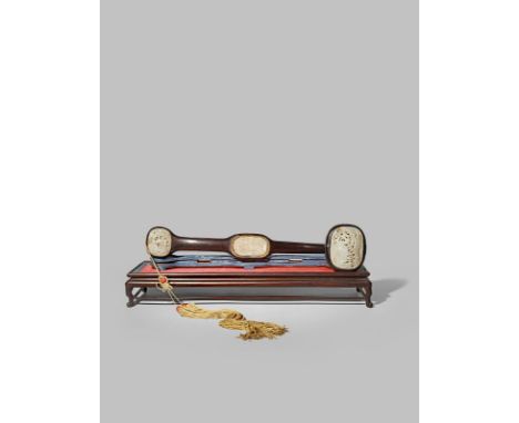 *A CHINESE JADE-MOUNTED HARDWOOD RUYI SCEPTRE QING DYNASTY Mounted with two jade plaques, each carved in relief with a duck o