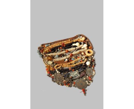 A COLLECTION OF TIBETAN BEADS, MALA 19TH CENTURY Comprising: seven rosaries, three metal amulets, a bone ring, a turquoise pe