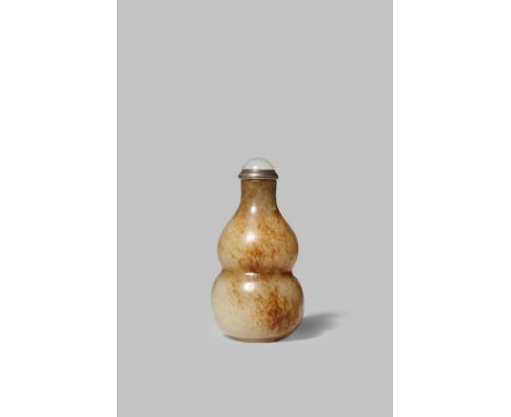 A CHINESE CELADON JADE SNUFF BOTTLE QING DYNASTY Carved as a double gourd with a tall neck, the stone with russet-brown stria