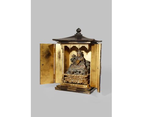 A LARGE JAPANESE BLACK LACQUER PORTABLE SHRINE, ZUSHI 19TH CENTURY The hinged double doors opening to a lacquered wood figure