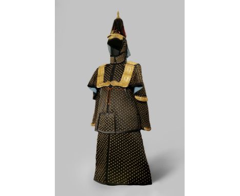 *A CHINESE BLUE-BLACK GROUND SILK SUIT OF CEREMONIAL ARMOUR AND HELMET OF A GENERAL QING DYNASTY In dark blue-black satin wit