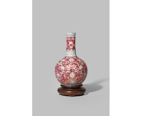A CHINESE FAMILLE ROSE 'BAJIXIANG' BOTTLE VASE EARLY 20TH CENTURY Decorated with stylised lotus leaves and flowerheads and th