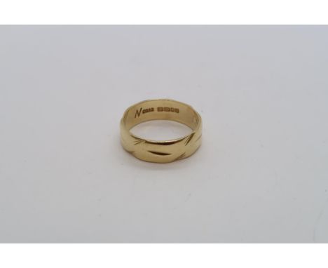 An 18ct yellow gold hallmarked band ring, size M, approx 4.6 grams 