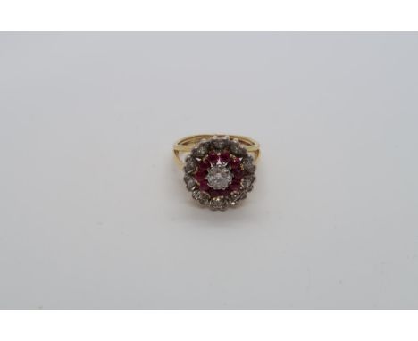 An approx 18ct yellow gold (tested) diamond and ruby cluster ring, size M, approx 6.4 grams 