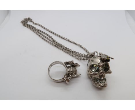An Alexander McQueen skull pendant on chain, pendant 3cm, together with an Alexander McQueen ring, size P/Q 
