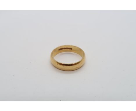 A 22ct yellow gold hallmarked band ring, size N, approx 4.6 grams 