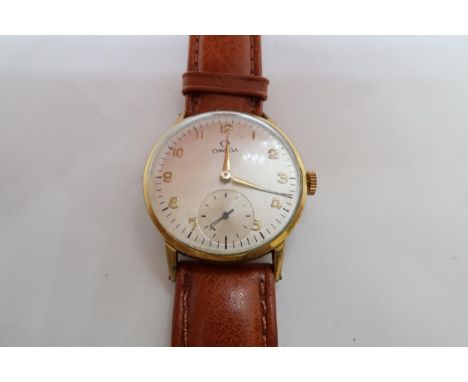 A gents Omega gold plated manual wind wristwatch - case 33mm - with seconds sub dial - working in the saleroom - glass loose 