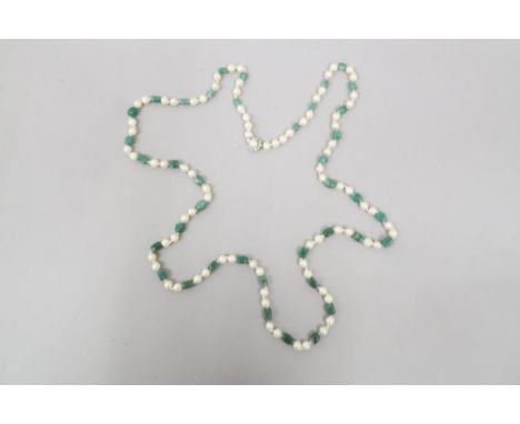 A Baroque pearl and jade necklace with a 14ct white gold and pearl clasp, pearls approx 8mm diameter - approx 120cm long 