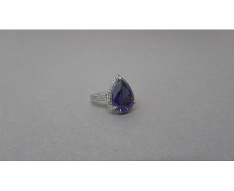 An 18ct white gold Uruguayan pear shape amethyst and diamond ring with diamond shoulders - amethyst is good quality and clari