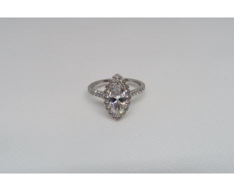 A stunning Marquise cut diamond ring set in platinum - The central Marquise cut diamond 1.07ct, colour F, clarity VS2 surroun