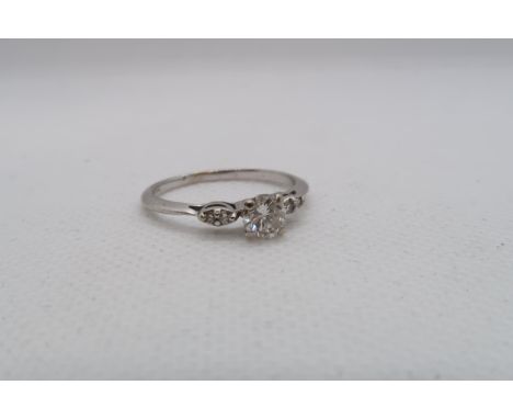 A 14ct white gold diamond ring with diamond shoulders - centre diamond approx 0.5ct - diamonds are bright and lively - ring s