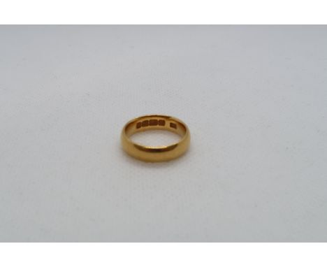 A 22ct (hallmarked) yellow gold band ring size J - approx weight 6.3 grams 