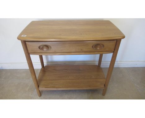 An Ercol Blonde side table with a drawer - Width 80cm x Height 73cm x Depth 40cm 