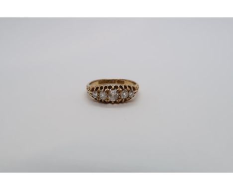 An 18ct yellow gold hallmarked diamond 5 stone ring set with graduated old cut diamonds, size O, approx 2.9 grams 